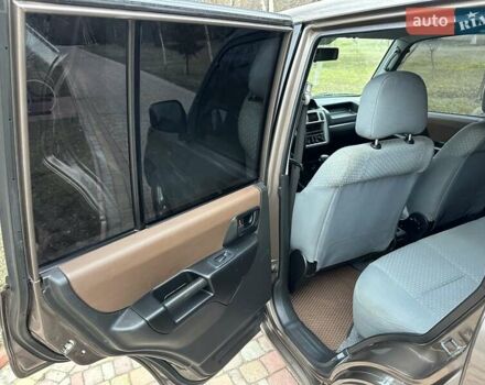 Бежевий Міцубісі Паджеро Пінін, об'ємом двигуна 1.83 л та пробігом 264 тис. км за 5750 $, фото 14 на Automoto.ua