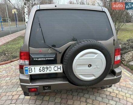 Бежевий Міцубісі Паджеро Пінін, об'ємом двигуна 1.83 л та пробігом 264 тис. км за 5750 $, фото 3 на Automoto.ua