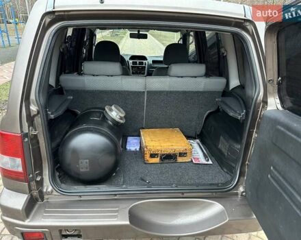 Бежевий Міцубісі Паджеро Пінін, об'ємом двигуна 1.83 л та пробігом 264 тис. км за 5750 $, фото 6 на Automoto.ua