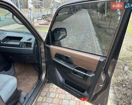 Бежевий Міцубісі Паджеро Пінін, об'ємом двигуна 1.83 л та пробігом 264 тис. км за 5750 $, фото 18 на Automoto.ua