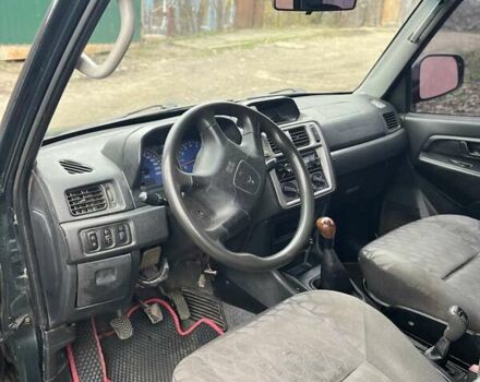 Зелений Міцубісі Паджеро Пінін, об'ємом двигуна 1.83 л та пробігом 890 тис. км за 2100 $, фото 5 на Automoto.ua