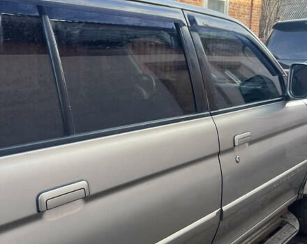 Бежевий Міцубісі Паджеро Спорт, об'ємом двигуна 3 л та пробігом 270 тис. км за 8300 $, фото 7 на Automoto.ua