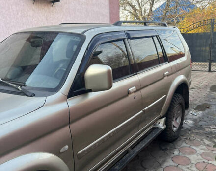 Бежевий Міцубісі Паджеро Спорт, об'ємом двигуна 3 л та пробігом 270 тис. км за 8300 $, фото 2 на Automoto.ua