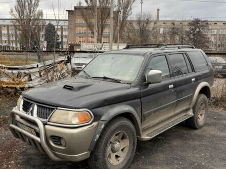 Бежевый Мицубиси Паджеро Спорт, объемом двигателя 2.8 л и пробегом 200 тыс. км за 2472 $, фото 1 на Automoto.ua