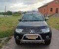Чорний Міцубісі Паджеро Спорт, об'ємом двигуна 2.5 л та пробігом 152 тис. км за 14000 $, фото 1 на Automoto.ua