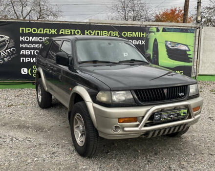 Черный Мицубиси Паджеро Спорт, объемом двигателя 3 л и пробегом 280 тыс. км за 6800 $, фото 2 на Automoto.ua