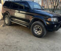 Чорний Міцубісі Паджеро Спорт, об'ємом двигуна 3 л та пробігом 313 тис. км за 6999 $, фото 2 на Automoto.ua