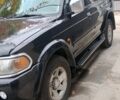 Черный Мицубиси Паджеро Спорт, объемом двигателя 3 л и пробегом 300 тыс. км за 7500 $, фото 1 на Automoto.ua