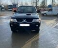 Чорний Міцубісі Паджеро Спорт, об'ємом двигуна 2.5 л та пробігом 209 тис. км за 8300 $, фото 1 на Automoto.ua