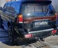 Чорний Міцубісі Паджеро Спорт, об'ємом двигуна 2.5 л та пробігом 300 тис. км за 6500 $, фото 1 на Automoto.ua