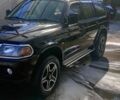 Чорний Міцубісі Паджеро Спорт, об'ємом двигуна 2.5 л та пробігом 300 тис. км за 6500 $, фото 2 на Automoto.ua