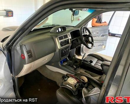 Черный Мицубиси Паджеро Спорт, объемом двигателя 3 л и пробегом 100 тыс. км за 4500 $, фото 2 на Automoto.ua