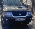 Чорний Міцубісі Паджеро Спорт, об'ємом двигуна 2.5 л та пробігом 300 тис. км за 6500 $, фото 1 на Automoto.ua