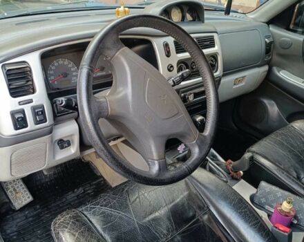 Чорний Міцубісі Паджеро Спорт, об'ємом двигуна 2.5 л та пробігом 275 тис. км за 9300 $, фото 3 на Automoto.ua