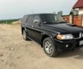 Чорний Міцубісі Паджеро Спорт, об'ємом двигуна 2.5 л та пробігом 308 тис. км за 4800 $, фото 1 на Automoto.ua