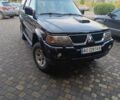 Чорний Міцубісі Паджеро Спорт, об'ємом двигуна 2.5 л та пробігом 275 тис. км за 9300 $, фото 1 на Automoto.ua