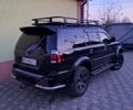 Черный Мицубиси Паджеро Спорт, объемом двигателя 3 л и пробегом 255 тыс. км за 9500 $, фото 1 на Automoto.ua