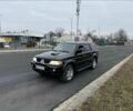 Чорний Міцубісі Паджеро Спорт, об'ємом двигуна 2.5 л та пробігом 248 тис. км за 4100 $, фото 1 на Automoto.ua