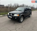Черный Мицубиси Паджеро Спорт, объемом двигателя 3 л и пробегом 240 тыс. км за 8500 $, фото 1 на Automoto.ua
