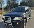 Черный Мицубиси Паджеро Спорт, объемом двигателя 3 л и пробегом 280 тыс. км за 9800 $, фото 2 на Automoto.ua