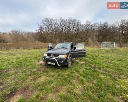 Черный Мицубиси Паджеро Спорт, объемом двигателя 3 л и пробегом 180 тыс. км за 8600 $, фото 1 на Automoto.ua