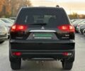 Чорний Міцубісі Паджеро Спорт, об'ємом двигуна 2.5 л та пробігом 197 тис. км за 12990 $, фото 6 на Automoto.ua