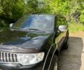 Чорний Міцубісі Паджеро Спорт, об'ємом двигуна 2.5 л та пробігом 150 тис. км за 16700 $, фото 1 на Automoto.ua