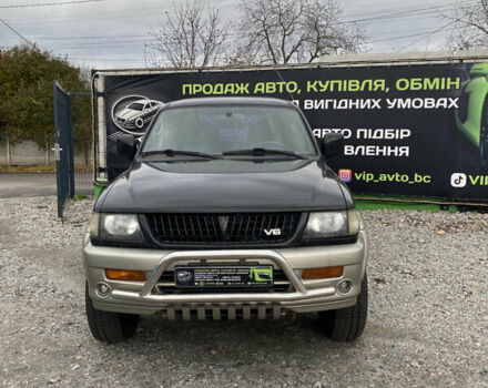 Черный Мицубиси Паджеро Спорт, объемом двигателя 3 л и пробегом 280 тыс. км за 6800 $, фото 1 на Automoto.ua