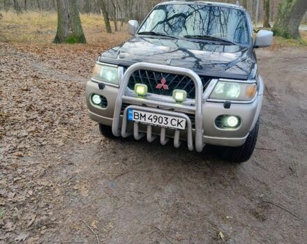 Чорний Міцубісі Паджеро Спорт, об'ємом двигуна 3 л та пробігом 375 тис. км за 11449 $, фото 1 на Automoto.ua
