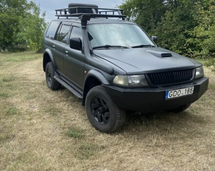 Черный Мицубиси Паджеро Спорт, объемом двигателя 2.5 л и пробегом 200 тыс. км за 3600 $, фото 1 на Automoto.ua