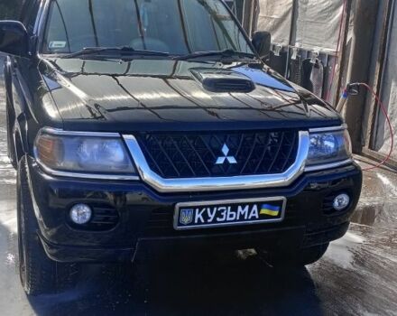 Чорний Міцубісі Паджеро Спорт, об'ємом двигуна 2.5 л та пробігом 300 тис. км за 6500 $, фото 1 на Automoto.ua