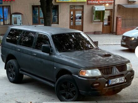 Черный Мицубиси Паджеро Спорт, объемом двигателя 2.5 л и пробегом 400 тыс. км за 4276 $, фото 1 на Automoto.ua