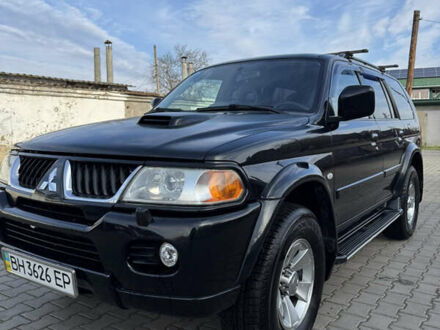 Чорний Міцубісі Паджеро Спорт, об'ємом двигуна 2.5 л та пробігом 225 тис. км за 9500 $, фото 1 на Automoto.ua
