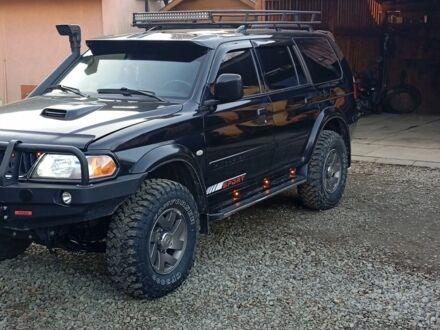 Черный Мицубиси Паджеро Спорт, объемом двигателя 2.5 л и пробегом 279 тыс. км за 13000 $, фото 1 на Automoto.ua