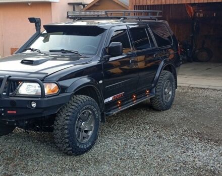 Чорний Міцубісі Паджеро Спорт, об'ємом двигуна 2.5 л та пробігом 279 тис. км за 13000 $, фото 1 на Automoto.ua