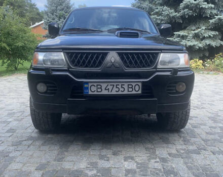 Чорний Міцубісі Паджеро Спорт, об'ємом двигуна 2.48 л та пробігом 327 тис. км за 11600 $, фото 1 на Automoto.ua