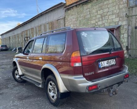 Червоний Міцубісі Паджеро Спорт, об'ємом двигуна 3 л та пробігом 350 тис. км за 3500 $, фото 4 на Automoto.ua