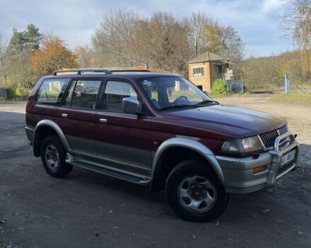 Червоний Міцубісі Паджеро Спорт, об'ємом двигуна 3 л та пробігом 350 тис. км за 3500 $, фото 1 на Automoto.ua