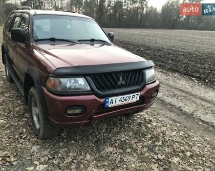 Красный Мицубиси Паджеро Спорт, объемом двигателя 3 л и пробегом 350 тыс. км за 5500 $, фото 2 на Automoto.ua