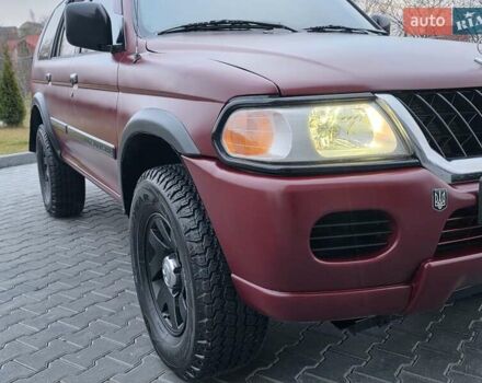 Красный Мицубиси Паджеро Спорт, объемом двигателя 3 л и пробегом 155 тыс. км за 5777 $, фото 14 на Automoto.ua