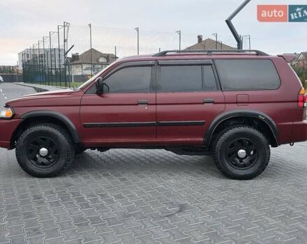 Красный Мицубиси Паджеро Спорт, объемом двигателя 3 л и пробегом 155 тыс. км за 5777 $, фото 7 на Automoto.ua