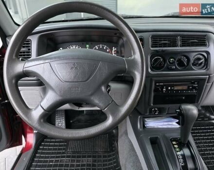 Красный Мицубиси Паджеро Спорт, объемом двигателя 3 л и пробегом 155 тыс. км за 5777 $, фото 50 на Automoto.ua