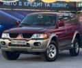 Червоний Міцубісі Паджеро Спорт, об'ємом двигуна 3 л та пробігом 212 тис. км за 6999 $, фото 1 на Automoto.ua
