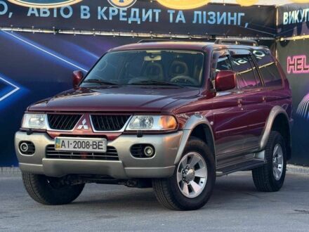 Красный Мицубиси Паджеро Спорт, объемом двигателя 3 л и пробегом 212 тыс. км за 6999 $, фото 1 на Automoto.ua