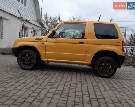 Желтый Мицубиси Паджеро Спорт, объемом двигателя 0.6 л и пробегом 150 тыс. км за 3200 $, фото 5 на Automoto.ua