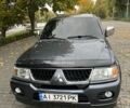 Серый Мицубиси Паджеро Спорт, объемом двигателя 3 л и пробегом 75 тыс. км за 11999 $, фото 1 на Automoto.ua