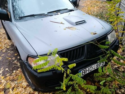 Серый Мицубиси Паджеро Спорт, объемом двигателя 2.5 л и пробегом 247 тыс. км за 5400 $, фото 1 на Automoto.ua