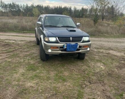 Синій Міцубісі Паджеро Спорт, об'ємом двигуна 2 л та пробігом 256 тис. км за 6000 $, фото 1 на Automoto.ua