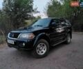 Синий Мицубиси Паджеро Спорт, объемом двигателя 2.5 л и пробегом 373 тыс. км за 4900 $, фото 1 на Automoto.ua