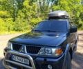 Синій Міцубісі Паджеро Спорт, об'ємом двигуна 3 л та пробігом 268 тис. км за 9000 $, фото 1 на Automoto.ua